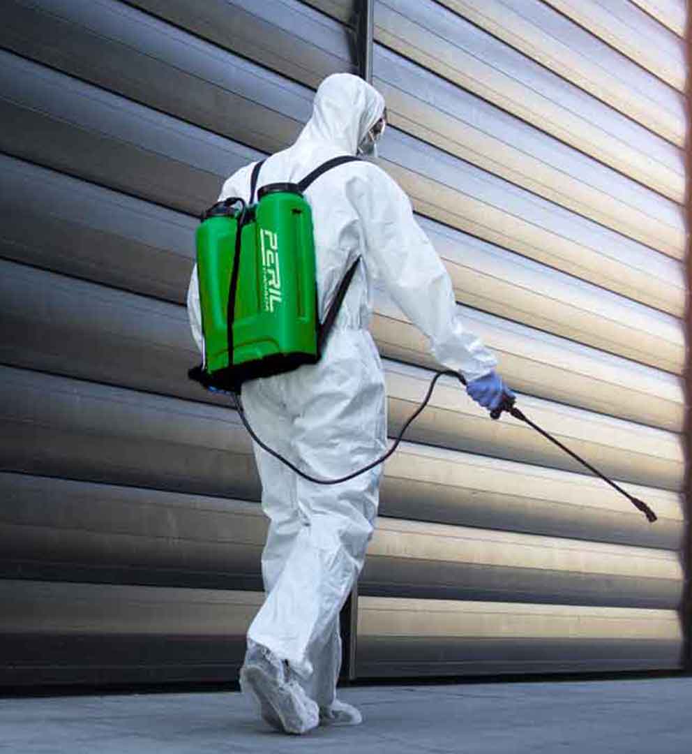 property restoration experts spraying mold treatment